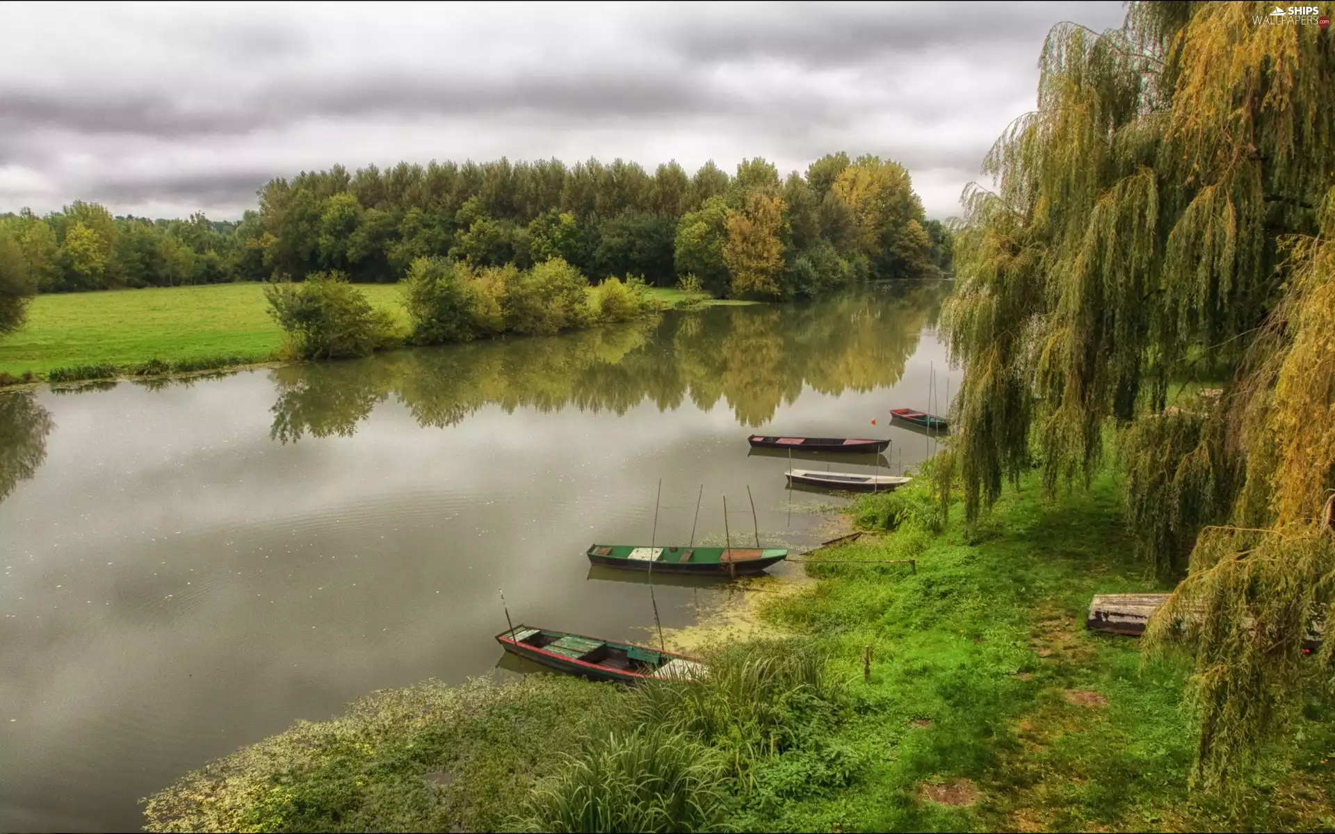 River, woods, clouds, boats