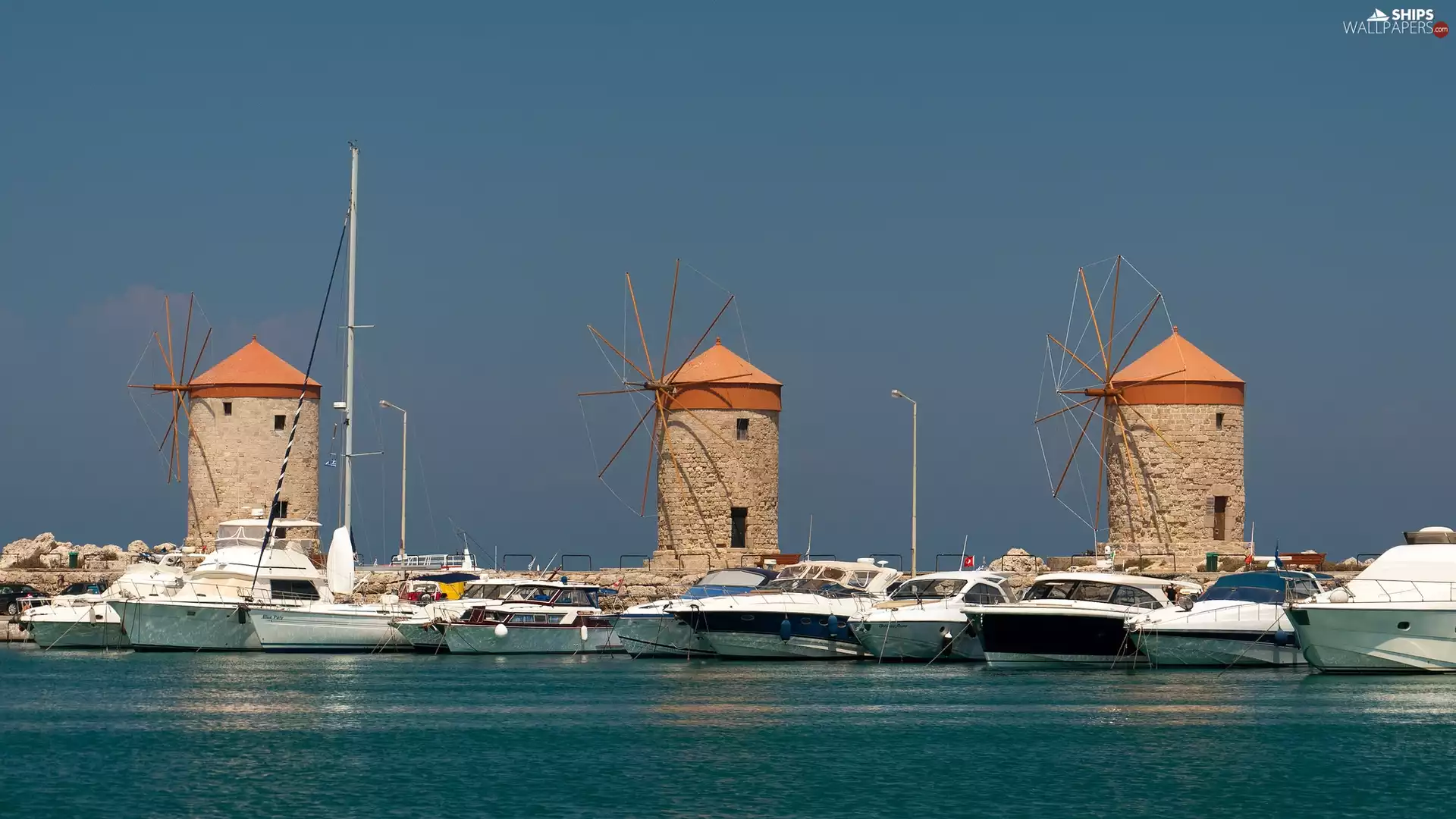 Windmills, motorboat, Rhodes Island, Mandraki Harbour, Greece