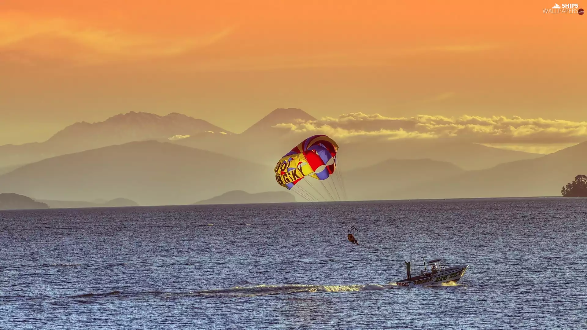 Mountains, Motor boat, parachute, sea