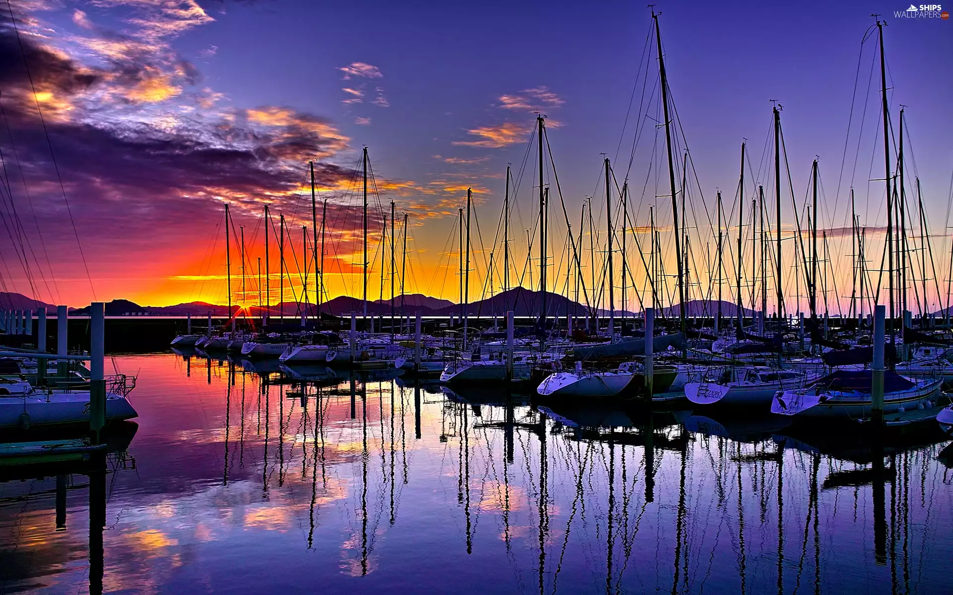 Yachts, sun, sea, west