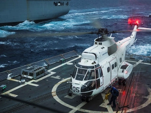 a man, Helicopter, aircraft carrier