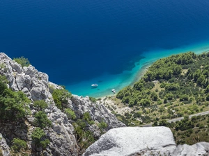 Mountains, rocks, motorboat, sea